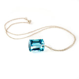 white gold emerald cut blue topaz necklace