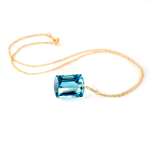 yellow gold emerald cut blue topaz necklace